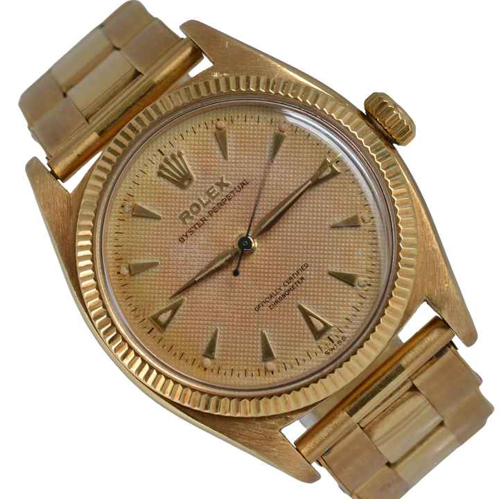  Rolex Oyster Perpetual 6502 OCC Honeycomb cream dial yellow gold 18KT 1957 